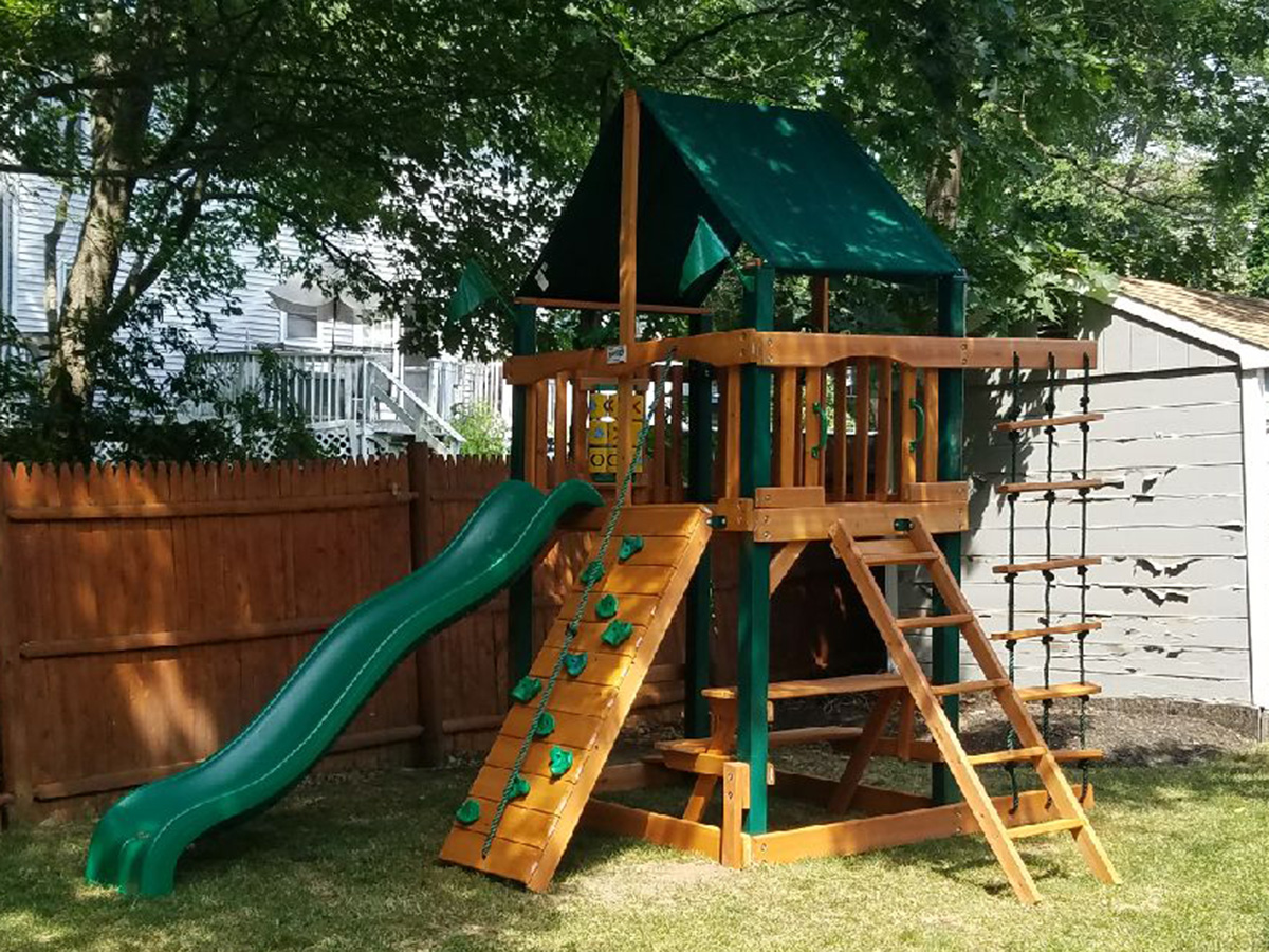 Gorilla Chateau Tower Swing Set Installation in Reading, MA